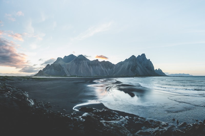 Dramatic Nordic landscape with waterfalls under a bright summer sky