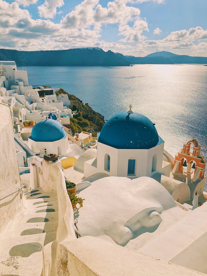 White-washed buildings and blue domes overlooking the Aegean Sea